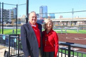 Judy and Brad Kaplan standing at the top of the stands at MSU Denver's softball stadium.