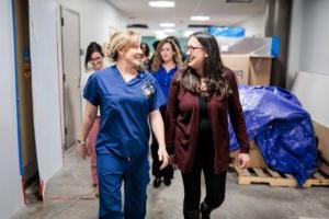 MSU Denver nursing faculty, Jenny Allert, DNP, MSN, RN, assistant professor, left, and Mary Tucker, DNP, RN, CRN, CHSE, Director of Interprofessional Simulation and Skills Hub, right, walk through the halls of the new SIM LABS on Feb. 26, 2024. Photo by Alyson McClaran